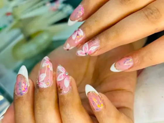 Hand-painted floral nail art on almond nails