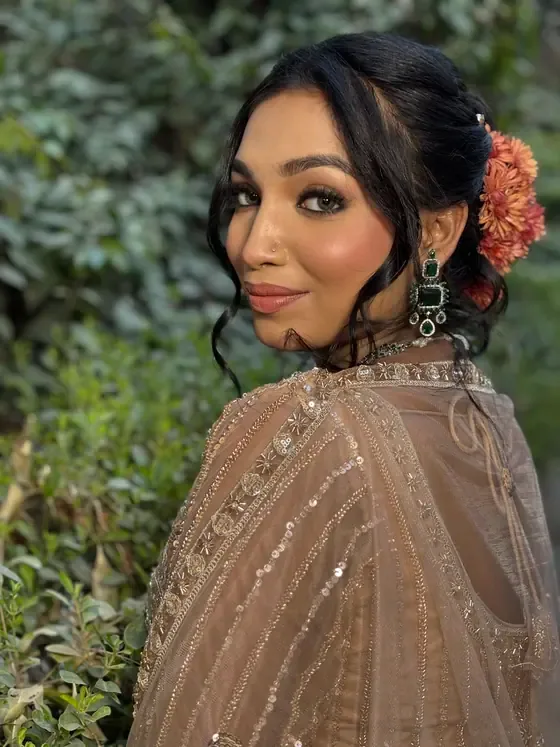 Occasion makeup in soft nude tones with flowers in the hair